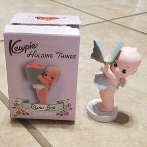 Smoko x Kewpie Holding Things: Kewpie Holds A Butterfly Figure